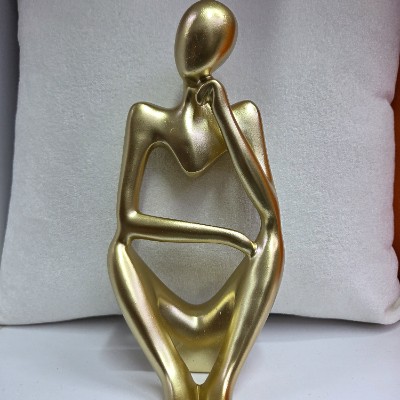 Big gold man thinker 